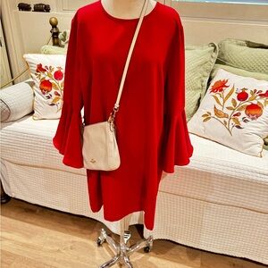 Adorable red dress with fun bell style sleeve!